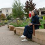 sitting_at_bench_stock